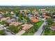 Aerial view of a home nestled in a community with ponds, lush greenery, and well-maintained streets at 6528 Coopers Hawk Ct, Lakewood Ranch, FL 34202