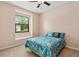 Charming bedroom with a window seat and a bed with nautical-themed bedding at 6528 Coopers Hawk Ct, Lakewood Ranch, FL 34202