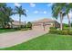 Well-maintained home features a three-car garage and beautiful landscaping at 6528 Coopers Hawk Ct, Lakewood Ranch, FL 34202