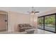 Cozy living room with tile floors and sliding glass doors to the pool area at 6528 Coopers Hawk Ct, Lakewood Ranch, FL 34202