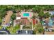 Aerial view of a well-maintained community with a pool, recreation area, and ample parking at 6860 Whitman Ct # 32B, Sarasota, FL 34243