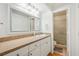 Bathroom featuring a vanity with a large mirror, a toilet, and a glass door walk-in shower at 6860 Whitman Ct # 32B, Sarasota, FL 34243
