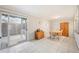 Open dining area with tile floors, sliding door access, and a wooden table set perfect for Gathering meals at 6860 Whitman Ct # 32B, Sarasota, FL 34243