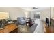 Relaxing living room featuring tile floors, ceiling fan, and access to the outdoors at 6860 Whitman Ct # 32B, Sarasota, FL 34243