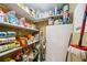Walk-in pantry with plenty of storage for food and household items at 6860 Whitman Ct # 32B, Sarasota, FL 34243