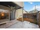 Private patio with sliding glass doors and adjacent wooden deck at 6860 Whitman Ct # 32B, Sarasota, FL 34243