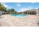 Inviting community pool area with ample lounge seating, perfect for relaxing and enjoying the sunshine at 6860 Whitman Ct # 32B, Sarasota, FL 34243