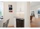 Wet bar with a wine refrigerator and granite countertop, conveniently located near the main living area at 7003 Lancaster Ct, University Park, FL 34201