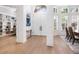 Light and bright entry foyer with high ceilings, light wood floors, and adjacent dining space at 7003 Lancaster Ct, University Park, FL 34201