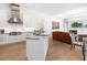 Modern kitchen with granite countertops, stainless steel appliances, and an open layout to the living room at 7003 Lancaster Ct, University Park, FL 34201
