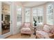 Sitting area with shuttered windows, light walls, comfortable furniture, and access to the pool at 7003 Lancaster Ct, University Park, FL 34201