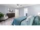 Relaxing bedroom with a ceiling fan and an ensuite bathroom at 714 & 716 Apalachicola Rd, Venice, FL 34285