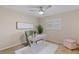 Bright bedroom featuring a white desk, ceiling fan and neutral walls at 714 & 716 Apalachicola Rd, Venice, FL 34285