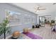 Bonus room with lots of light, ceiling fan, and slider to the kitchen at 714 & 716 Apalachicola Rd, Venice, FL 34285