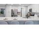 Kitchen featuring stainless appliances, white cabinets and granite countertop breakfast bar at 714 & 716 Apalachicola Rd, Venice, FL 34285