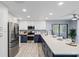 Modern kitchen featuring stainless appliances, white cabinets with a granite countertop breakfast bar at 714 & 716 Apalachicola Rd, Venice, FL 34285