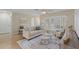 Relaxing living room featuring a white couch, neutral walls and natural light at 714 & 716 Apalachicola Rd, Venice, FL 34285