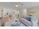 Open-concept living room with hardwood floors and views of the kitchen at 714 & 716 Apalachicola Rd, Venice, FL 34285