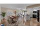 Open-concept living room featuring a dining area, updated kitchen, and hardwood floors at 714 & 716 Apalachicola Rd, Venice, FL 34285