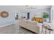 Bright living room with natural light, neutral tones, and wood-look floors at 714 & 716 Apalachicola Rd, Venice, FL 34285