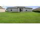 Spacious backyard with lush green lawn, ideal for outdoor activities and relaxation at 7295 Donahue St, Port Charlotte, FL 33981