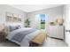 Comfortable bedroom with soft colors, a bench, and abundant natural light at 7295 Donahue St, Port Charlotte, FL 33981