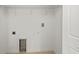 A clean laundry room with ample space for appliances and storage at 7295 Donahue St, Port Charlotte, FL 33981