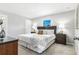 Serene bedroom featuring a plush bed, soft lighting, and a calming color scheme at 7295 Donahue St, Port Charlotte, FL 33981