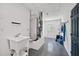 Unfinished basement area with sink, exterior access, and painted concrete floors at 8007 17Th Nw Ave, Bradenton, FL 34209