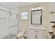 Well-lit bathroom with a glass-enclosed shower, white vanity, and modern fixtures at 8007 17Th Nw Ave, Bradenton, FL 34209