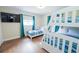 This bedroom includes a TV, bunk beds, and a twin bed with blue decor for entertainment and relaxation at 8007 17Th Nw Ave, Bradenton, FL 34209