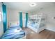 Bedroom featuring a bunk bed and a twin bed with blue decor for a fun and functional space at 8007 17Th Nw Ave, Bradenton, FL 34209