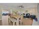 Open dining area with natural wood table, and cohesive furniture and textile accents at 8007 17Th Nw Ave, Bradenton, FL 34209