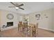 Cozy dining area with rustic table and painted brick fireplace, perfect for Gathering gatherings at 8007 17Th Nw Ave, Bradenton, FL 34209