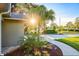 The sun shines bright on the landscaped driveway that approaches the home at 8007 17Th Nw Ave, Bradenton, FL 34209