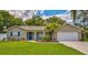 Charming single-story home with mature trees, manicured lawn, and a two-car garage at 8007 17Th Nw Ave, Bradenton, FL 34209