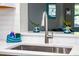 Stainless steel kitchen sink with modern faucet fixtures and bright natural light at 8007 17Th Nw Ave, Bradenton, FL 34209