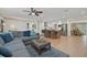 Spacious living room open to kitchen and dining area, featuring hardwood floors and modern decor at 8007 17Th Nw Ave, Bradenton, FL 34209