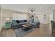 Comfortable living room with hardwood floors, bright natural light, and a modern sofa at 8007 17Th Nw Ave, Bradenton, FL 34209