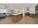 Open-concept living and kitchen area featuring hardwood floors and a large center island at 8007 17Th Nw Ave, Bradenton, FL 34209