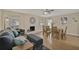 Spacious living room with painted brick fireplace, cozy furniture, and a dining area at 8007 17Th Nw Ave, Bradenton, FL 34209