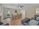 Bright and inviting living room with wood floors, modern decor, and a dining table under a ceiling fan at 8007 17Th Nw Ave, Bradenton, FL 34209