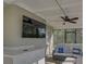 Covered outdoor patio space with TV, perfect for entertaining and relaxation at 8007 17Th Nw Ave, Bradenton, FL 34209