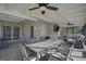 Covered patio area with dining, seating and access to pool and outdoor space at 8007 17Th Nw Ave, Bradenton, FL 34209