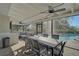 Screened-in patio features a dining table and chairs, seating area, and access to a swimming pool at 8007 17Th Nw Ave, Bradenton, FL 34209