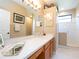 Well-lit bathroom with a spacious vanity and a walk-in shower at 8078 Stirling Falls Cir, Sarasota, FL 34243
