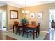 Elegant dining room with a chandelier and seating for six at 8078 Stirling Falls Cir, Sarasota, FL 34243