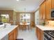 Bright eat-in kitchen area with white countertops and views of the outdoors at 8078 Stirling Falls Cir, Sarasota, FL 34243