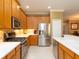 Well-equipped kitchen with stainless steel appliances and ample counter space at 8078 Stirling Falls Cir, Sarasota, FL 34243