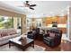 Cozy living space with sliding glass doors and an eat-in kitchen at 8078 Stirling Falls Cir, Sarasota, FL 34243